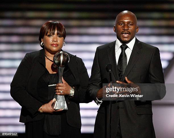 Nelson Mandela's daughter Zindzi Mandela and Nelson Mandela's grandson Zondwa Mandela accept the Arthur Ashe Courage Award on behalf of Nelson...