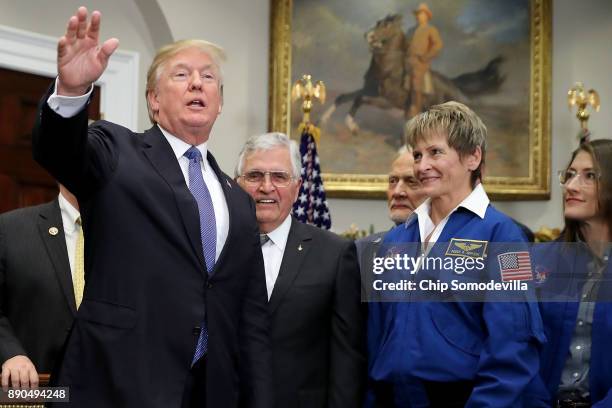 President Donald Trump departs after signing 'Space Policy Directive 1' during a ceremony with NASA astronauts Christina Koch, Peggy Whitson, Buzz...