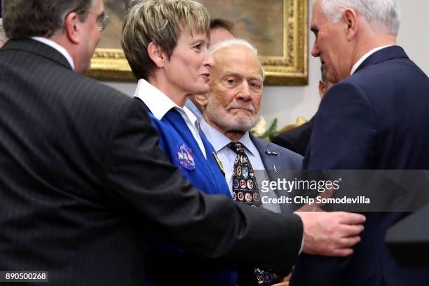 Astronaut Peggy Whitson and Apollo 11 astronaut Buzz Aldrin visit with Vice President Mike Pence after President Donald Trump signed 'Space Policy...