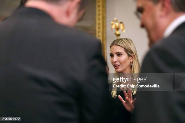 Ivanka Trump talks with guests after President Donald Trump signed 'Space Policy Directive 1' during a ceremony in the Roosevelt Room at the White...