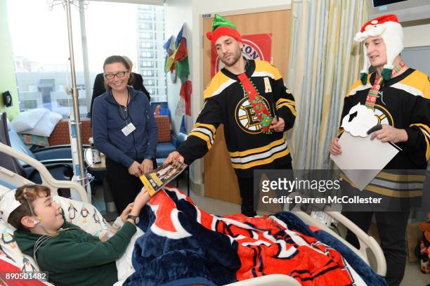 Boston Bruins visit with Patrice Bergeron, and Noel Acciari visit Graham and Mom at Boston Children's Hospital December 11, 2017 in Boston,...