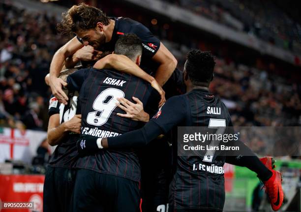 Georg Margreitter of Nuernberg celebrates with team mates after scoring his teams second goal during the Second Bundesliga match between Fortuna...