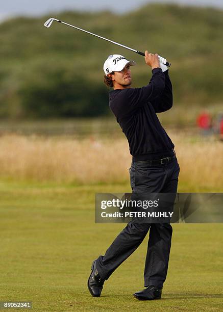 Australian golfer Adam Scott plays a shot on the first fairway on the first day of the 138th British Open Championship at Turnberry Golf Course in...