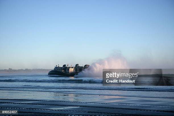 Navy Landing Craft Air Cushion unit approaches the beach to position themselves for the Talisman Saber 2009 joint exercise on July 15, 2009 on...