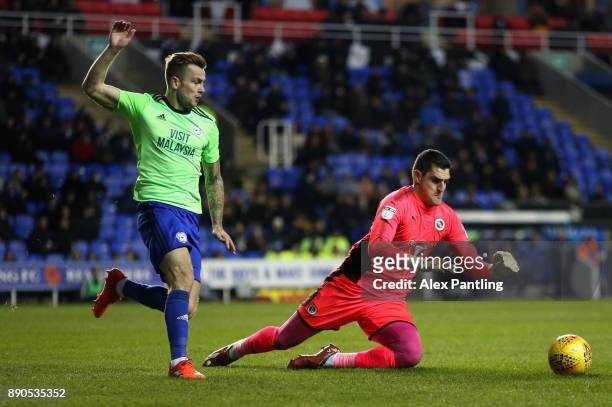 Vito Mannone of Reading collects the ball under pressure from Joe Ralls of Cardiff during the Sky Bet Championship match between Reading and Cardiff...