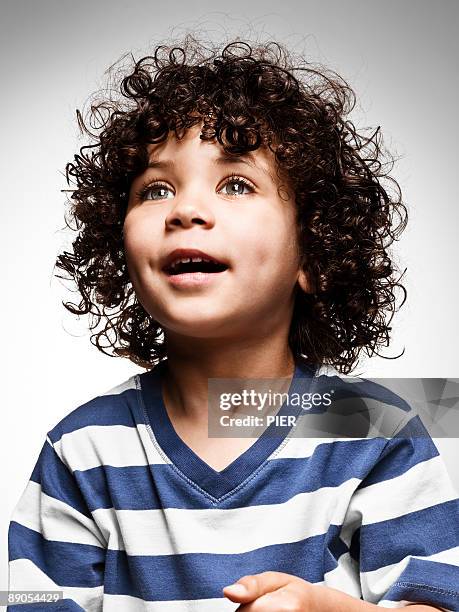 young boy looking into distance - portrait white background looking away stockfoto's en -beelden