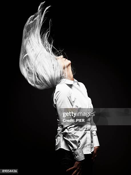 profile view of mature woman silver head of hair - white shirt stock pictures, royalty-free photos & images