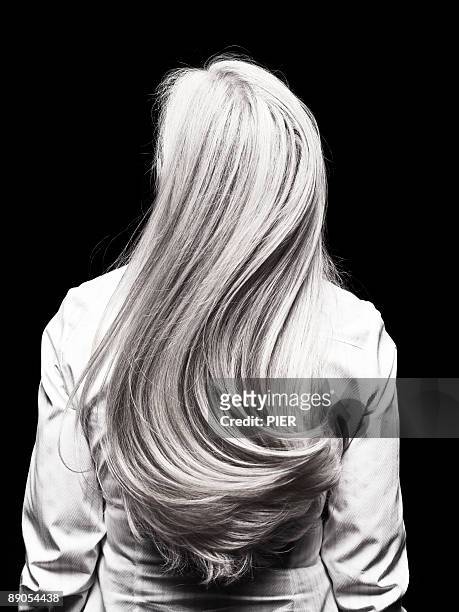 rear view of mature womans silver head of hair - hair toss stockfoto's en -beelden
