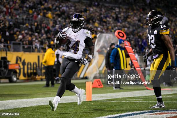 Baltimore Ravens Running back Alex Collins scores a rushing touchdown during the game between the Baltimore Ravens and the Pittsburgh Steelers on...