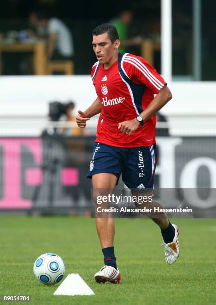 Lucio plays with the ball during the FC Bayern Muenchen training session at Bayern's training ground Saebener Strasse on July 16, 2009 in Munich,...
