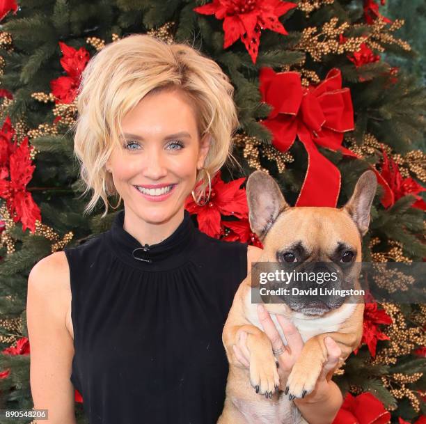 Actress Nicky Whelan and Yoda visit Hallmark's "Home & Family" at Universal Studios Hollywood on December 11, 2017 in Universal City, California.