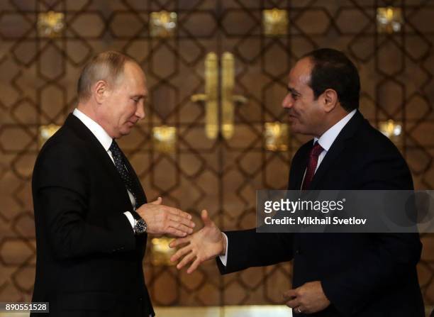 Russian President Vladimir Putin shakes hands with Egyptian President Abdel Fattah el-Sisi during their meeting on December 11, 2017 in Cairo, Egypt....