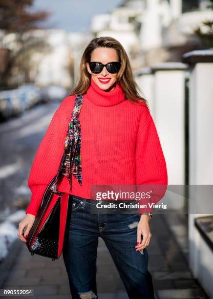Alexandra Lapp wearing a cropped red turtleneck from H&M, Adriano Goldschmied Boyfriend denim from AG Jeans, Diormania sunglasses by Dior, Opyum 110...