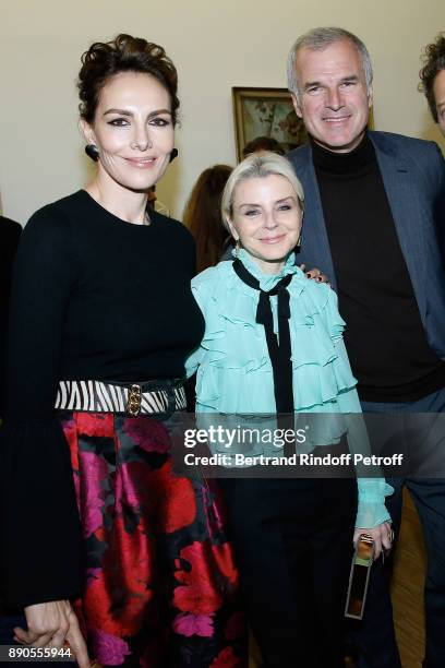 Stephanie Busuttil standing between Emmanuel Schreder and Adriana Abascal attend the Cesar Retrospective at Centre Pompidou on December 11, 2017 in...