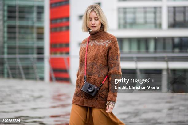 Lisa Hahnbueck wearing a brown knit Mulberry, a brown Rochas dress, golden Gianvito Rossi high heels on December 11, 2017 in Duesseldorf, Germany.