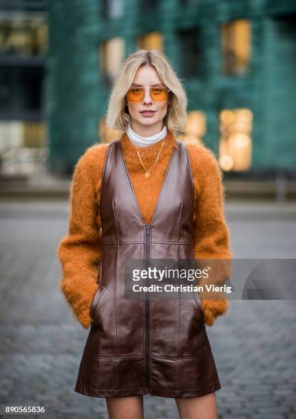 Lisa Hahnbueck wearing brown Chloe dress with zipper, brown Mulberry knit, red Zara overknee boots, Vouge eyewear sunglasses on December 11, 2017 in...