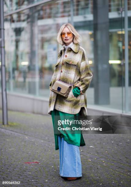 Lisa Hahnbueck wearing green Haider Ackermann dress, flared denim jeans Chloe, green checked Chloe coat, brown Aquazurra x Poppy Delevigne heels,...