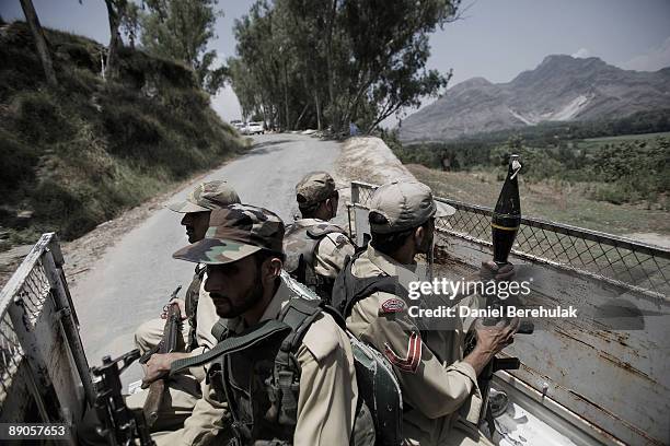 Pakistan Military patrol travels by road to the village of Sultanwas on July 16, 2009 near Dagar in Buner, Pakistan. Thousands of IDPs have started...