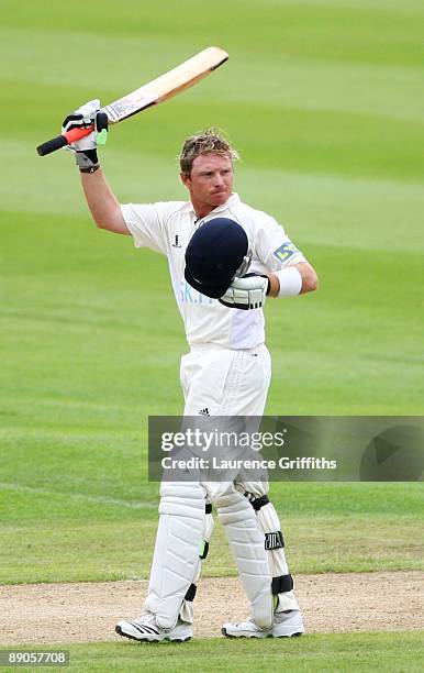 Ian Bell of Warwickshire acknowledges the crowd after reaching his century during Day 2 of the LV County Championship Division One match between...