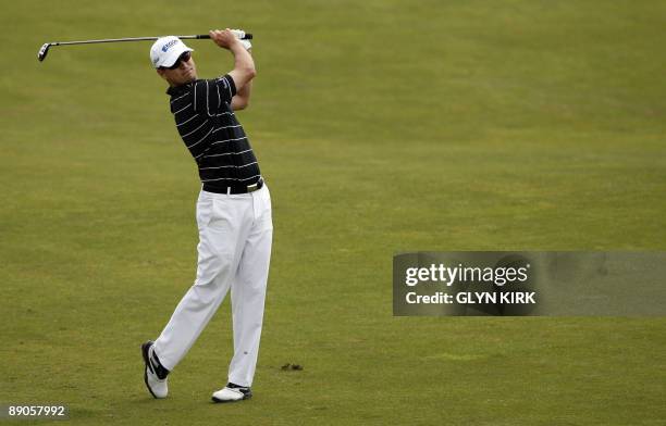 Golfer Zach Johnson plays a shot on the 7th fairway on the first day of the 138th British Open Championship at Turnberry Golf Course in south west...