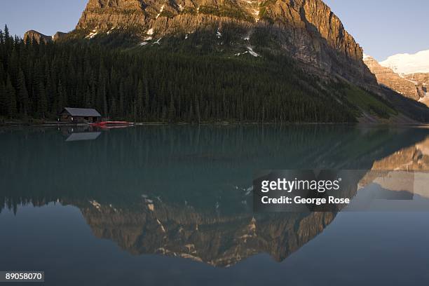 The Fairmont Chateau Lake Louise Hotel canoe boathouse and Fairview Mountain is seen in this 2009 Lake Louise, Canada, summer morning reflection...