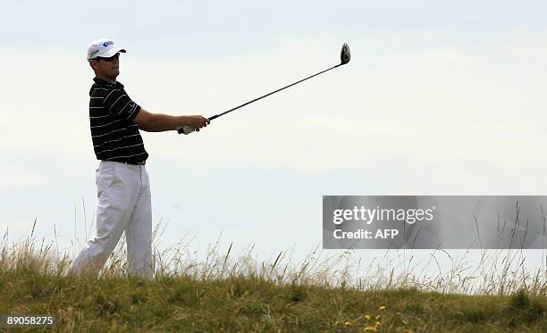 Golfer Zach Johnson watches his drive on the 7th tee on the first day of the 138th British Open Championship at Turnberry Golf Course in south west...