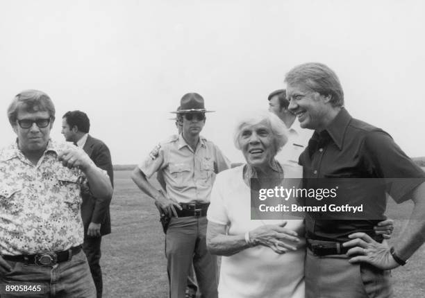 American President Jimmy Carter stands with his mother Lillian Carter and brother, entrepreneur Billy Carter , St. Simons Island, Georgia, 1977.