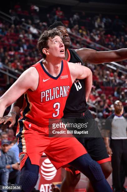 Omer Asik of the New Orleans Pelicans plays defense against Clint Cappella of the Houston Rockets on December 11, 2017 at the Toyota Center in...