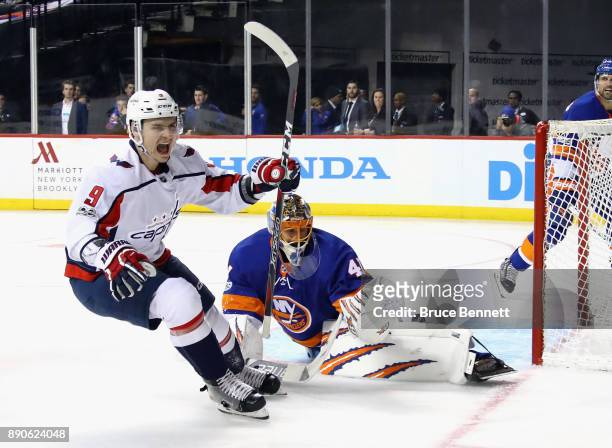 Dmitry Orlov of the Washington Capitals scores at 8:23 of the third period against Jaroslav Halak of the New York Islanders at the Barclays Center on...