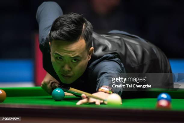 Marco Fu of Chinese Hong Kong plays a shot during his first round match against Duane Jones of Wales on day one of the 2017 Scottish Open at Emirates...