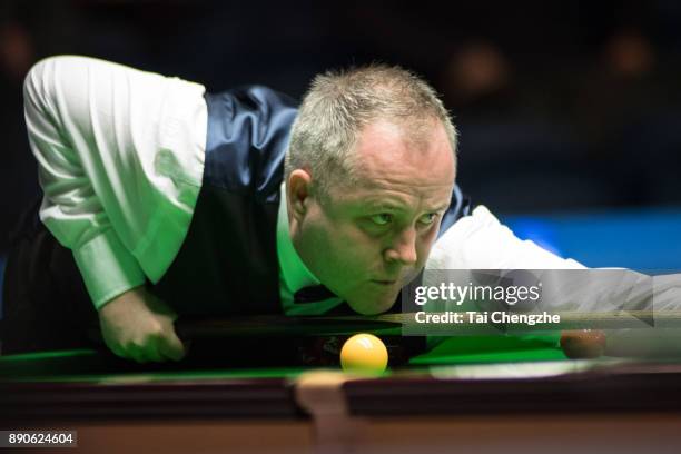 John Higgins of Scotland plays a shot during his first round match against Jack Lisowski of England on day one of the 2017 Scottish Open at Emirates...