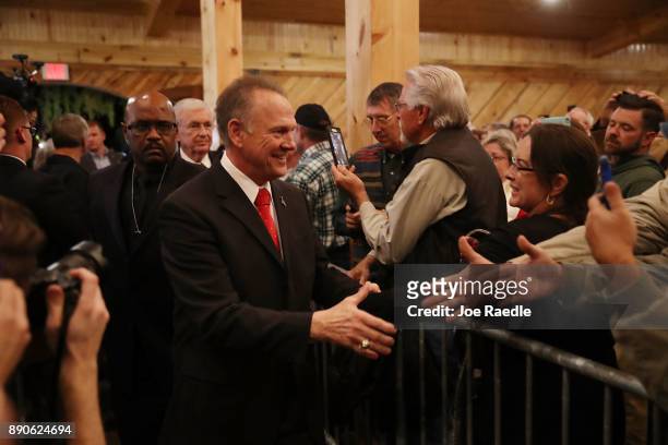 Republican Senatorial candidate Roy Moore arrives to speak during a campaign event at Jordan's Activity Barn on December 11, 2017 in Midland City,...