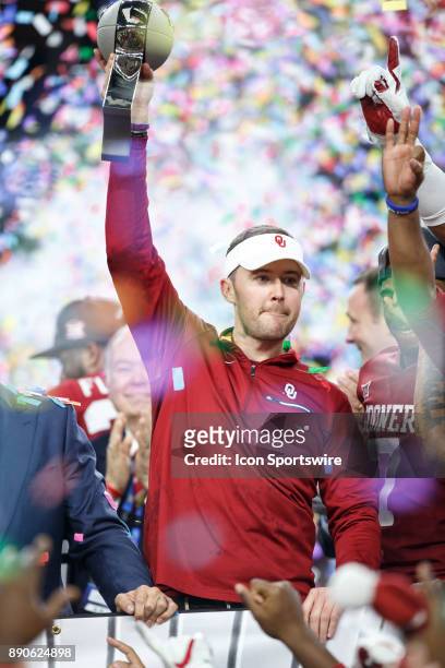 Oklahoma Sooners head coach Lincoln Riley lifts the championship trophy during the Big 12 Championship game between the Oklahoma Sooners and the TCU...
