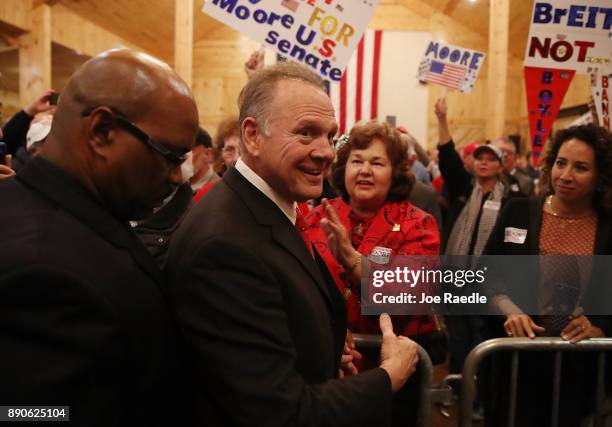 Republican Senatorial candidate Roy Moore arrives to speak during a campaign event at Jordan's Activity Barn on December 11, 2017 in Midland City,...