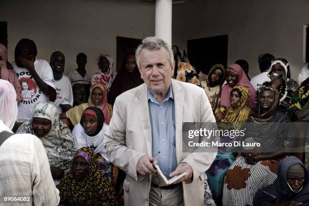 Martin Bell is seen as Somali IDPs are seen learning about child protection issues in 100 - Bush IDP Camp community center on May 10, 2009 in...