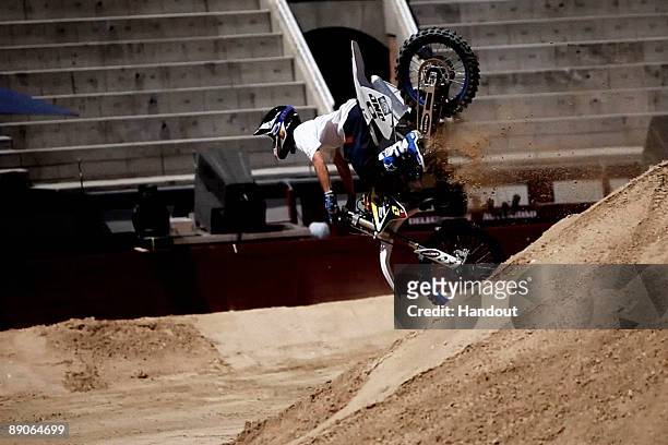 In this handout photo provided by Red Bull, French rider Charles Pages crashes after a failed attempt to pull a trick during practice for the fourth...