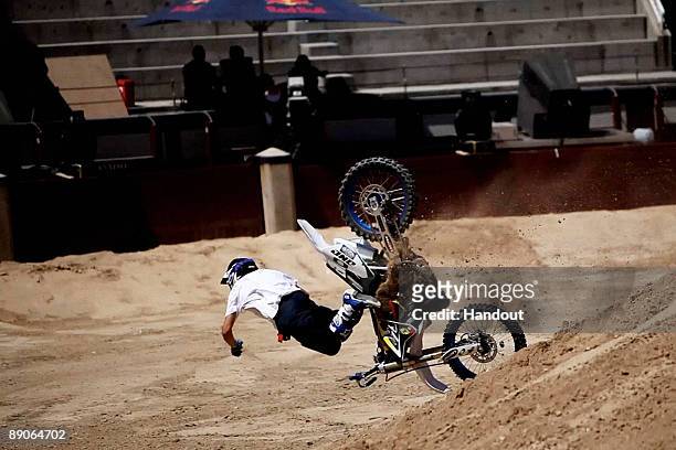 In this handout photo provided by Red Bull, French rider Charles Pages crashes after a failed attempt to pull a trick during practice for the fourth...