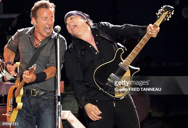 Rock singer Bruce Springsteen and guitarist Little Steven perform on stage with the E-Street band, on July 16, 2009 in Carhaix-Plouguer, western...