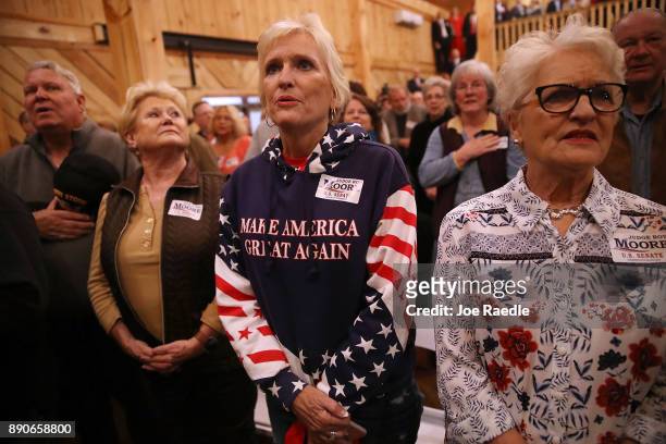 People wait for the arrival of Republican Senatorial candidate Roy Moore to speak during a campaign event at Jordan's Activity Barn on December 11,...