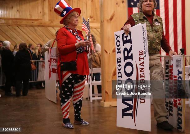 People attend a campaign rally for Republican Senatorial candidate Roy Moore at Jordan's Activity Barn on December 11, 2017 in Midland City, Alabama....