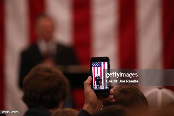 Republican Senatorial candidate Roy Moore is seen on cell phone screen as he speaks during a campaign event at Jordan's Activity Barn on December 11,...