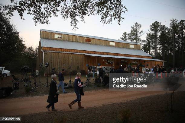 People arrive to hear Republican Senatorial candidate Roy Moore speak during a campaign event at Jordan's Activity Barn on December 11, 2017 in...