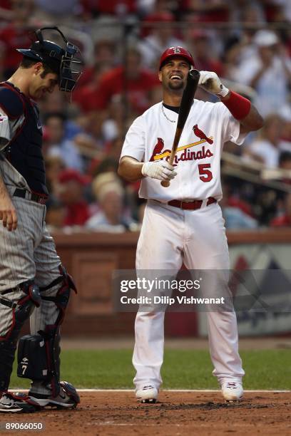 National League All-Star Albert Pujols of the St. Louis Cardinals shares a laugh with American League All-Star Joe Mauer of the Minnesota Twins...