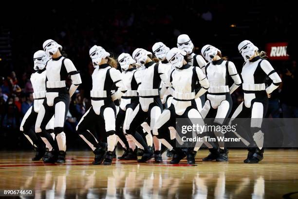The Houston Rockets Power Dancers perform wearing stormtrooper costumes during Star Wars night during the game between the Houston Rockets and the...