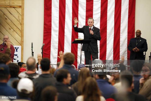 Roy Moore, Republican candidate for U.S. Senate from Alabama, waves during a campaign rally in Midland City, Alabama, U.S., on Monday, Dec. 11, 2017....