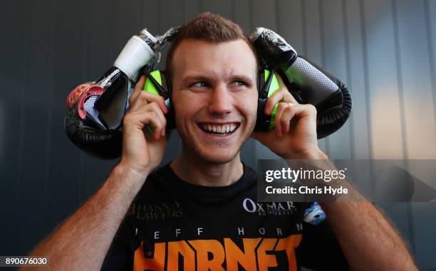 Jeff Horn wears boxing gloves on his head as a joke during the official weigh in at Sky Terrace on December 12, 2017 in Brisbane, Australia. Horn and...