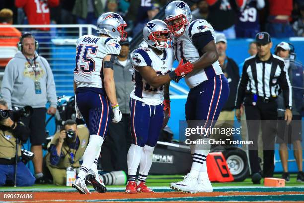 James White of the New England Patriots celebrates after scoring a touchdown in the fourth quarter against the Miami Dolphins at Hard Rock Stadium on...