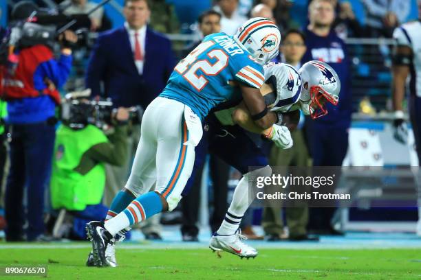 Alterraun Verner of the Miami Dolphins makes the tackle during the fourth quarter against the New England Patriots at Hard Rock Stadium on December...