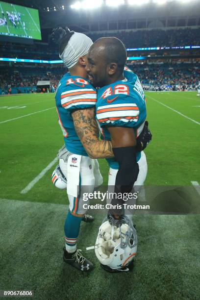 Kenny Stills and Alterraun Verner of the Miami Dolphins after the win against against the New England Patriots at Hard Rock Stadium on December 11,...