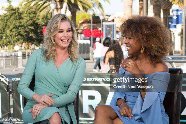 Rebecca Romijn and Tanika Ray visit "Extra" at Universal Studios Hollywood on December 11, 2017 in Universal City, California.